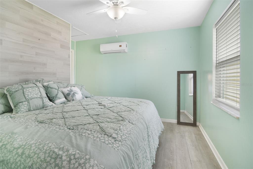 916 Fernald Street Edgewater, FL 32132 - Photo 9 of 27 a bedroom with a bed and a window