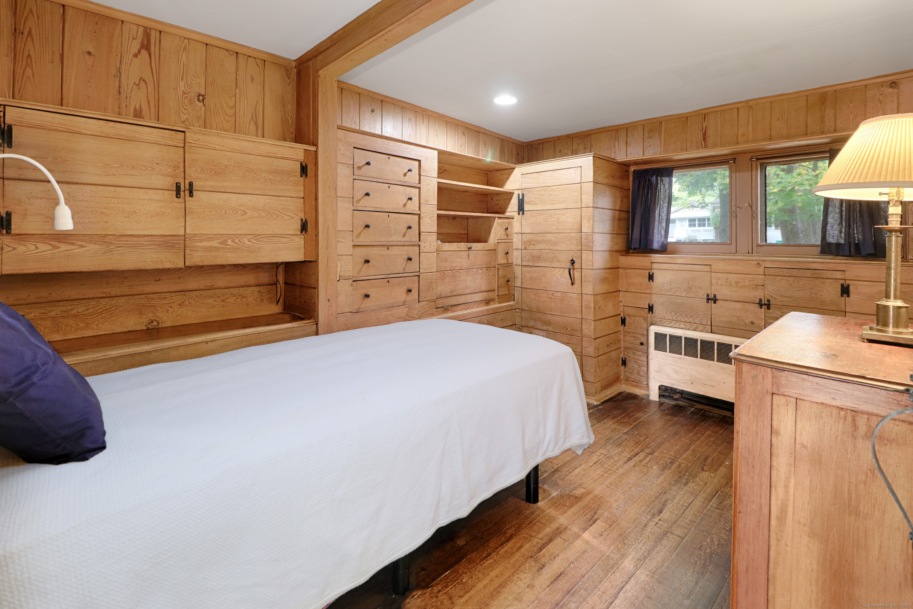 23 Bridge Street Westport, CT 06880 - Photo 22 of 39 a bedroom with a bed and a cabinets