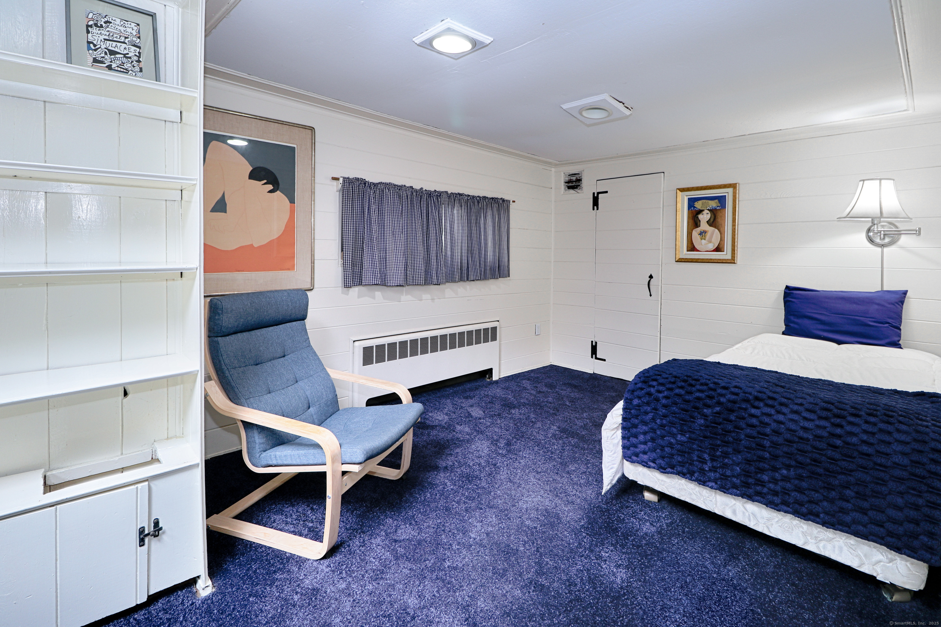 23 Bridge Street Westport, CT 06880 - Photo 24 of 39 a bedroom with a bed and a cabinets