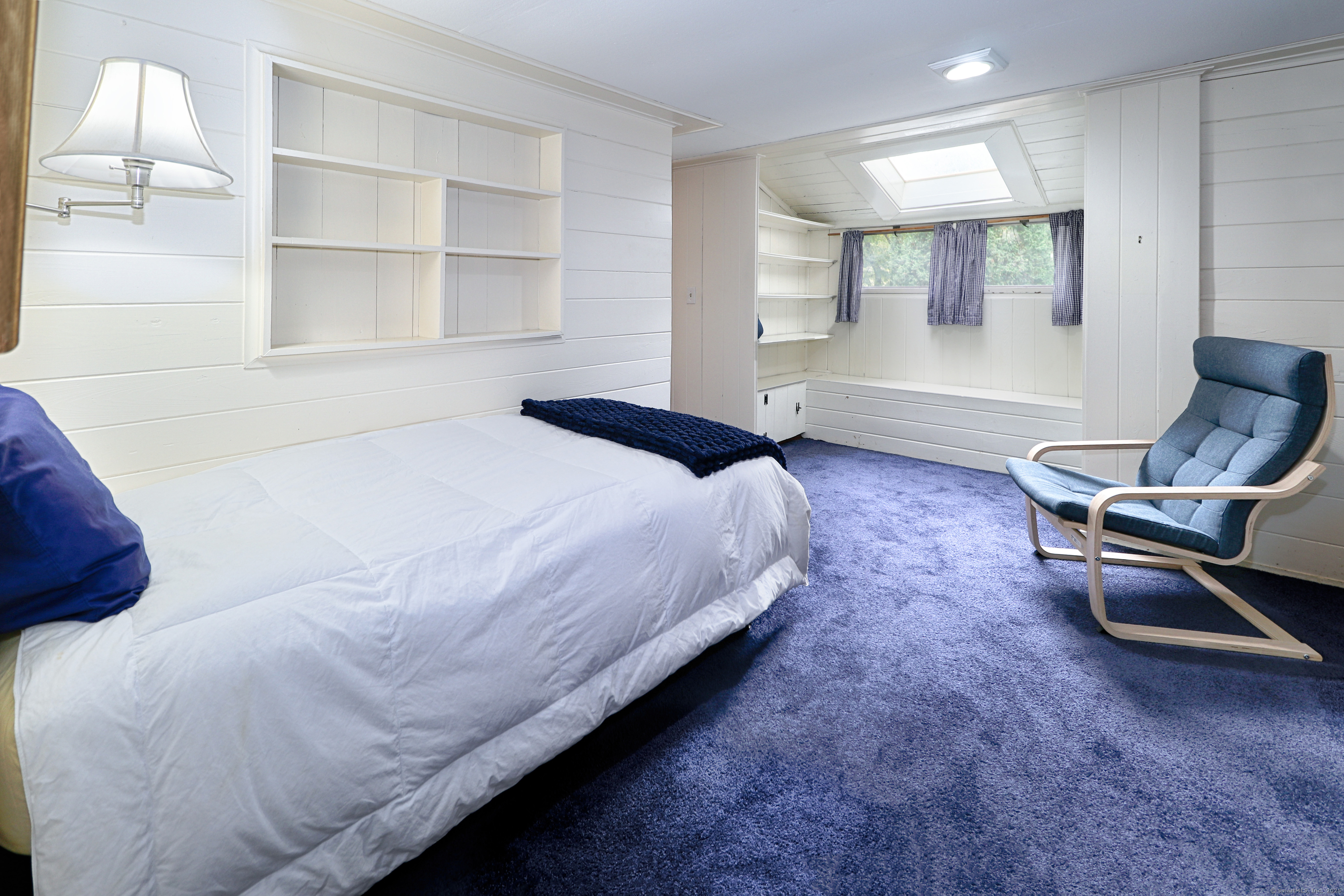 23 Bridge Street Westport, CT 06880 - Photo 25 of 39 a bedroom with a bed chair and dresser