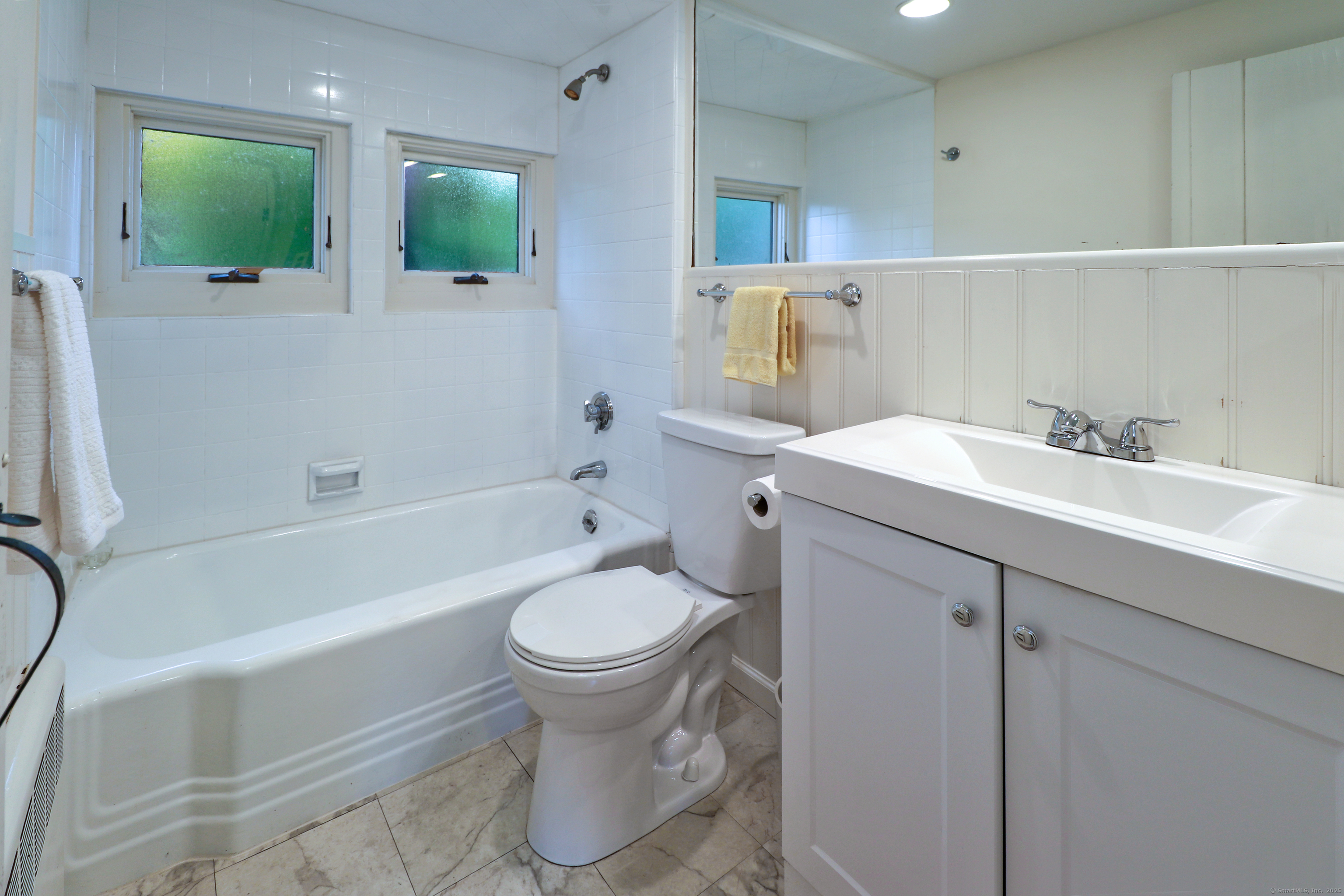 23 Bridge Street Westport, CT 06880 - Photo 26 of 39 a bathroom with a sink toilet and shower