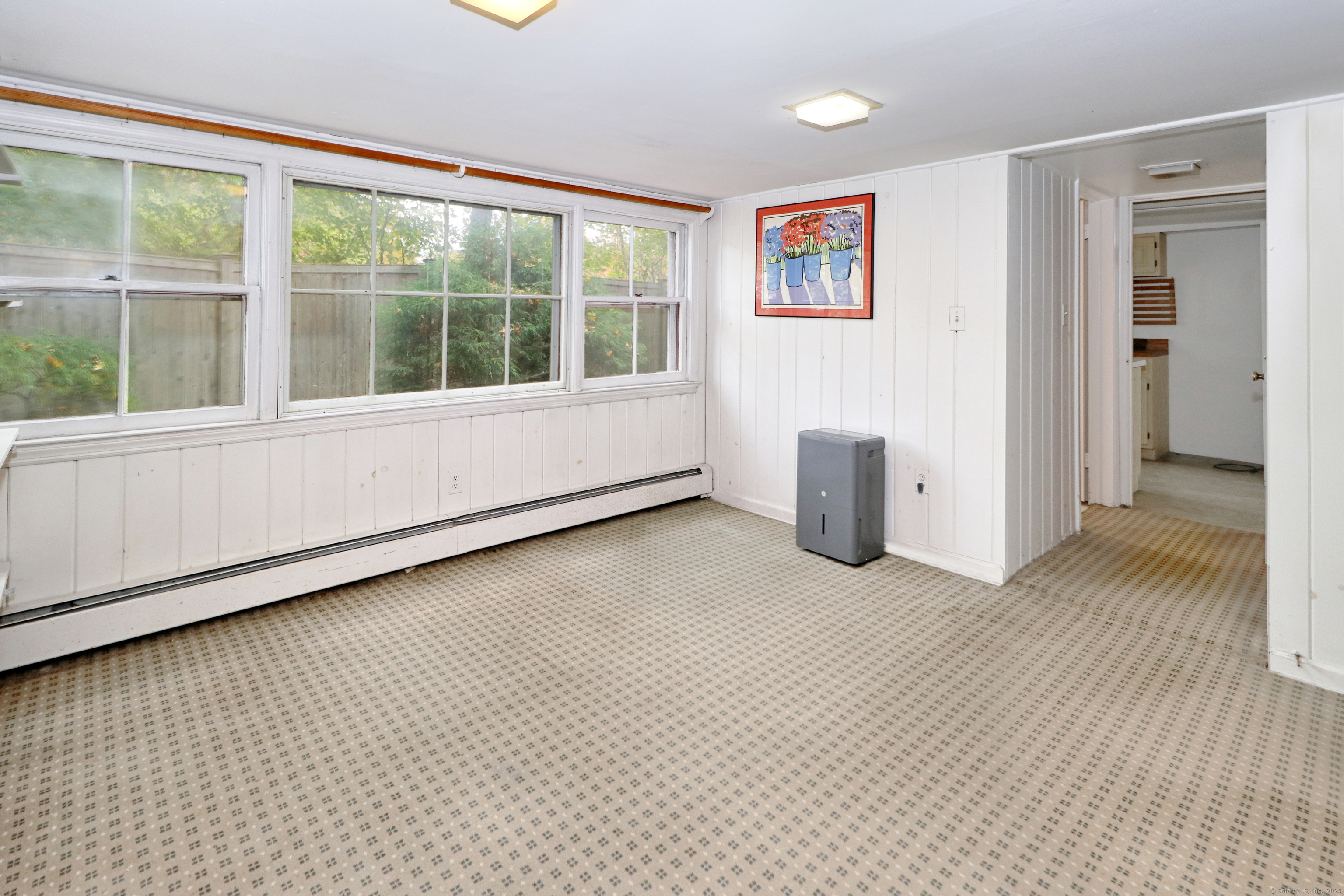 23 Bridge Street Westport, CT 06880 - Photo 27 of 39 a view of an empty room with wooden floor and a window
