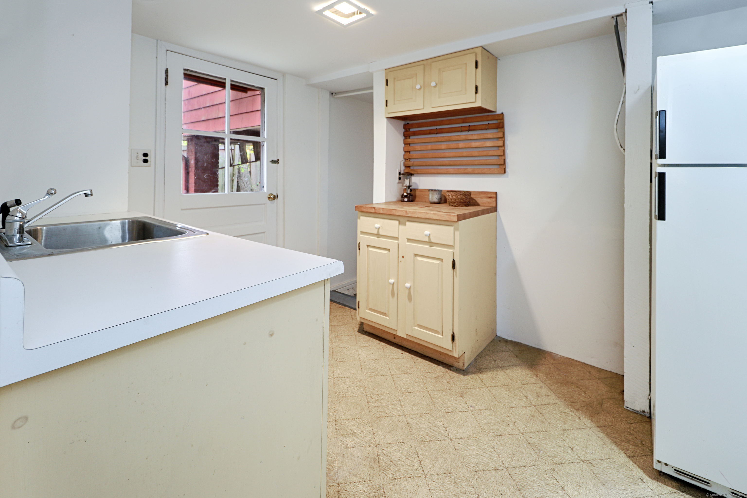 23 Bridge Street Westport, CT 06880 - Photo 28 of 39 a utility room with dryer and washer