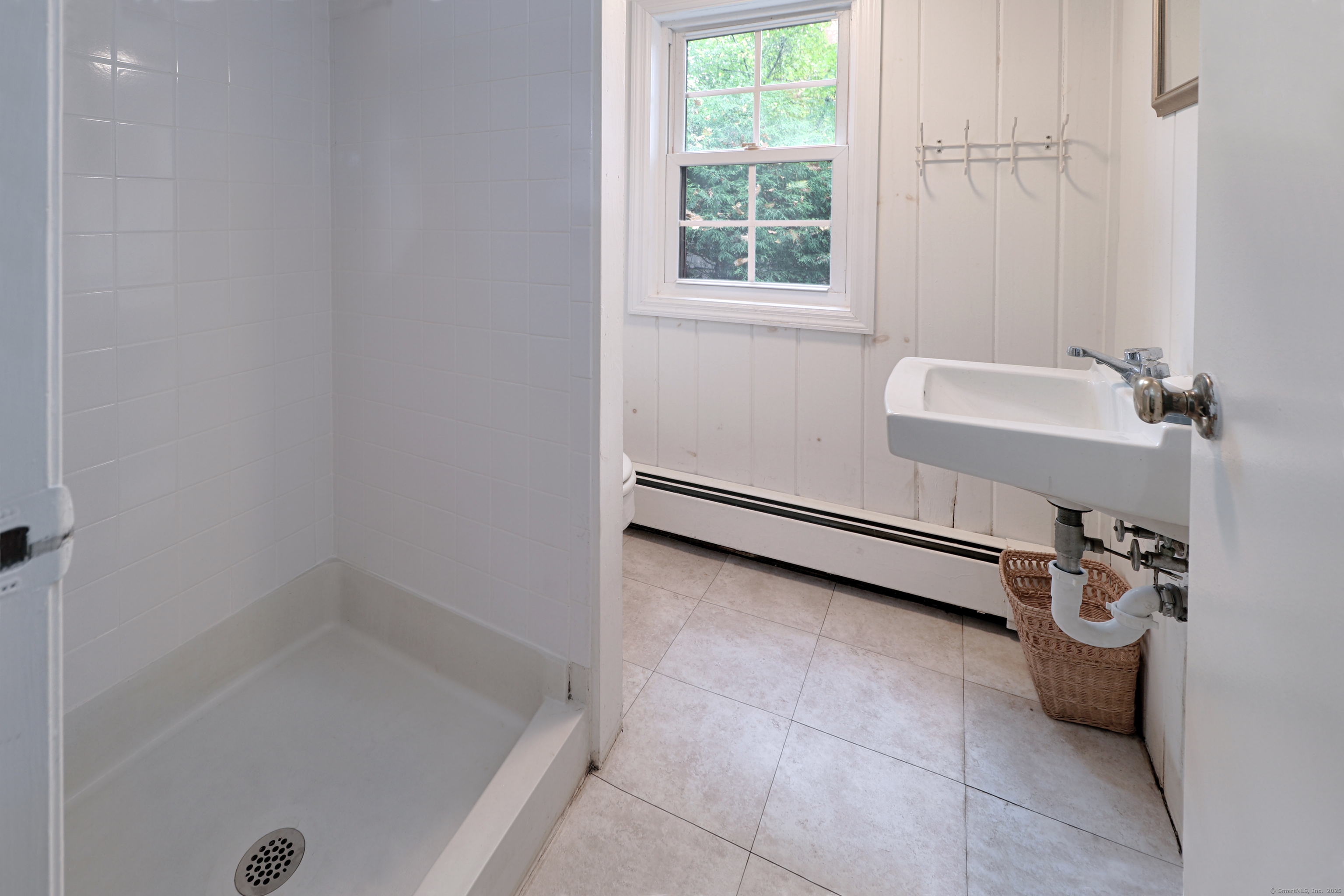 23 Bridge Street Westport, CT 06880 - Photo 29 of 39 a bathroom with a sink and a tub