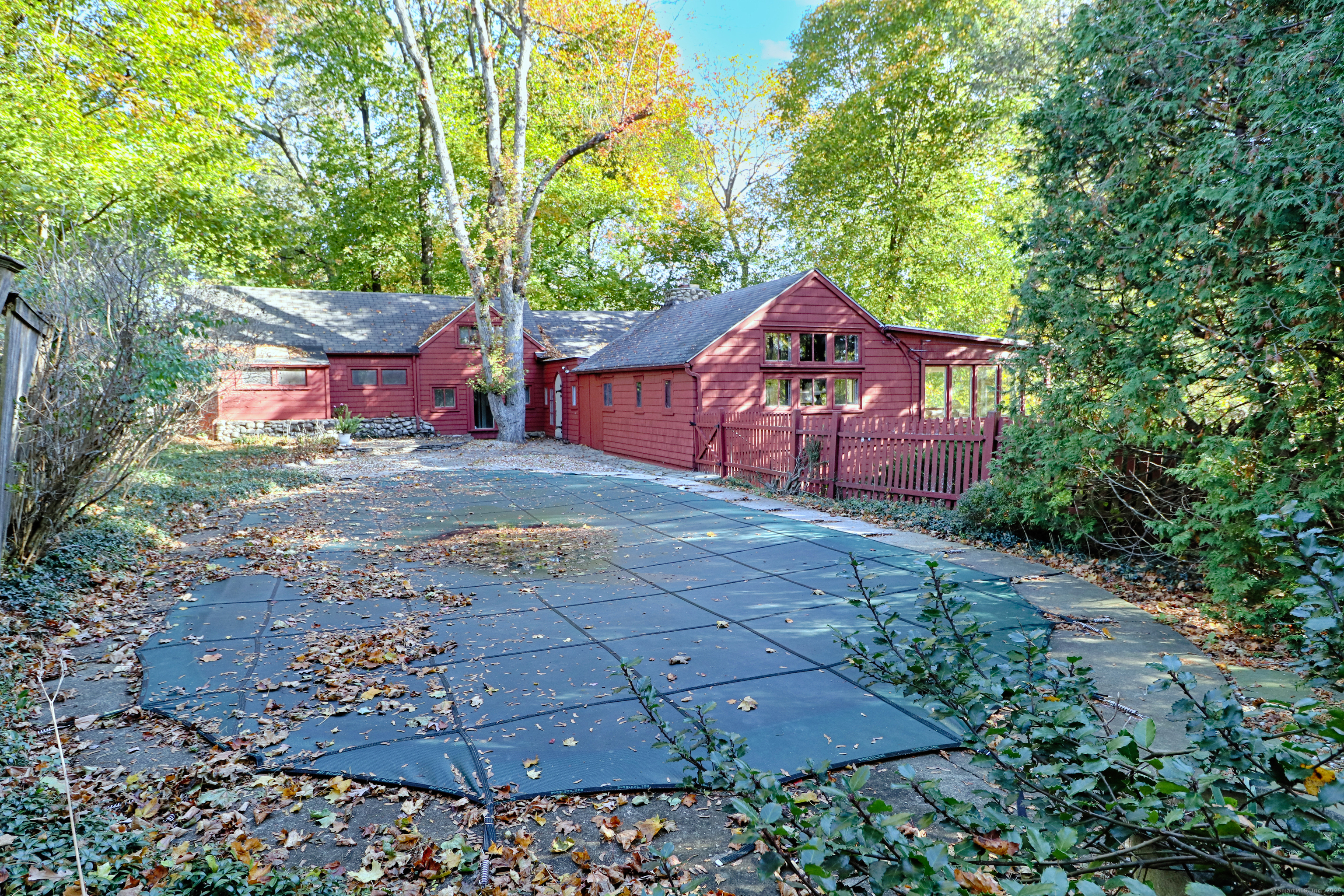 23 Bridge Street Westport, CT 06880 - Photo 32 of 39 a front view of a house with a yard and a large tree