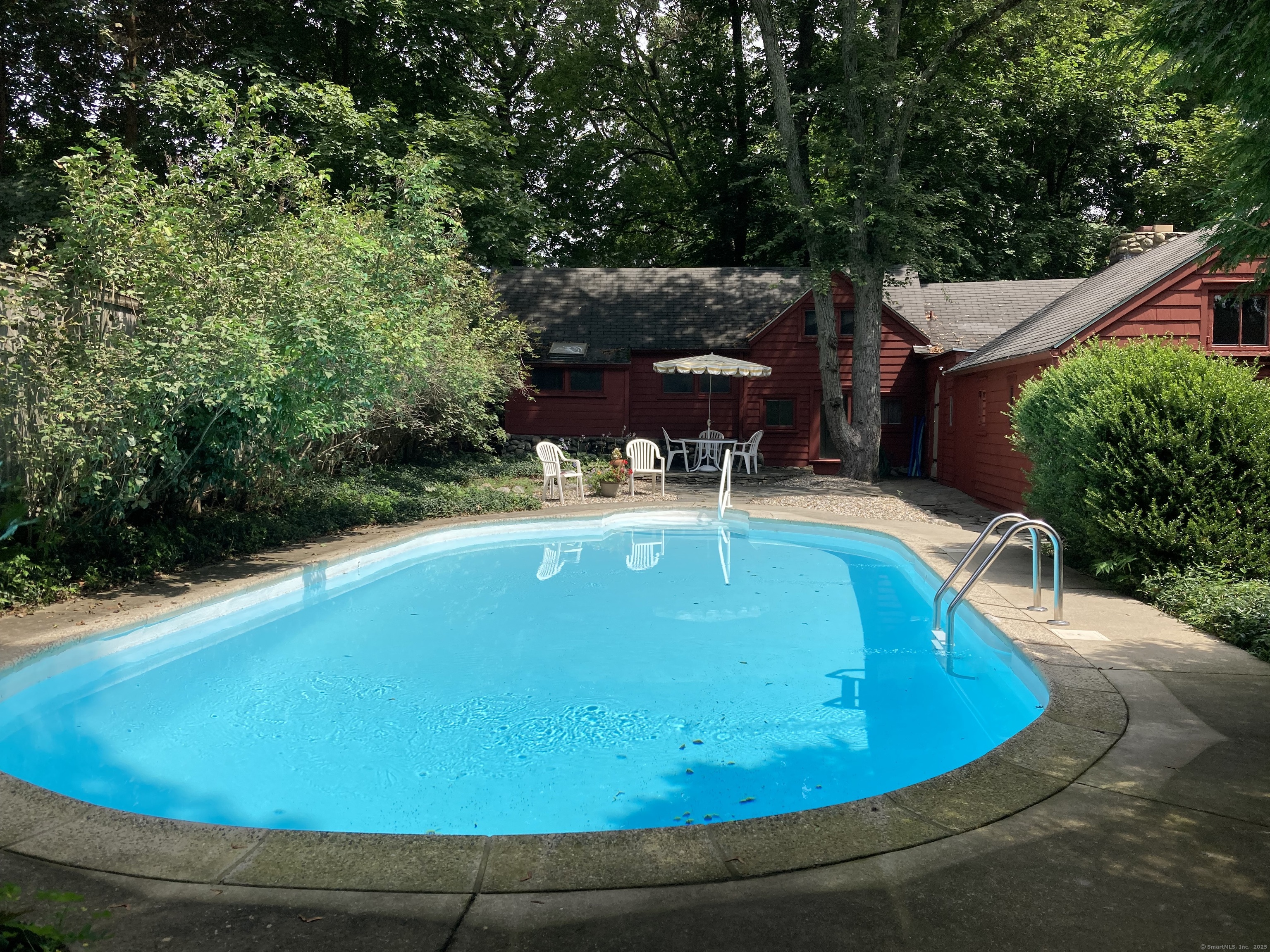 23 Bridge Street Westport, CT 06880 - Photo 38 of 39 a view of a swimming pool with a patio
