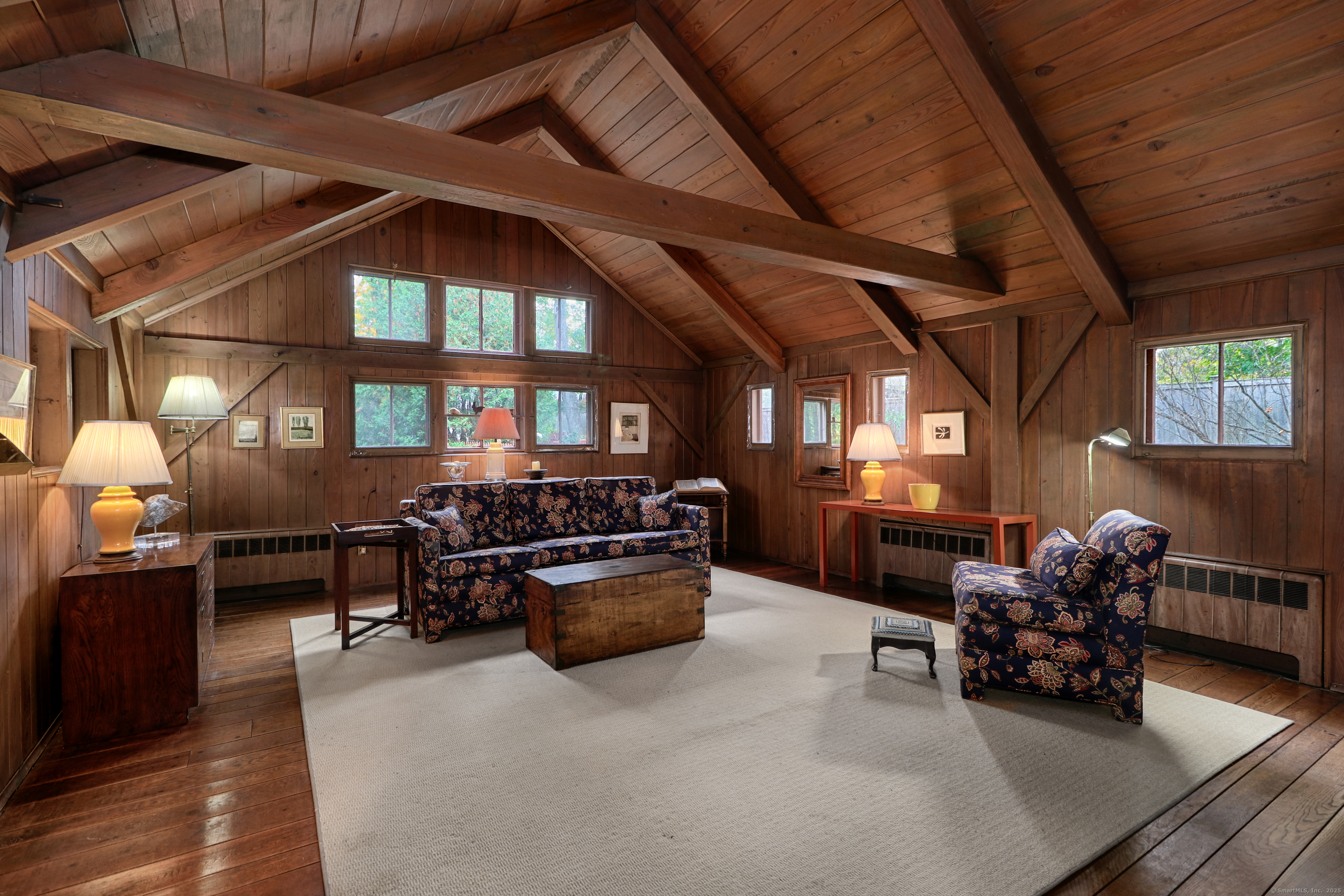 23 Bridge Street Westport, CT 06880 - Photo 8 of 39 a living room with furniture and a fireplace