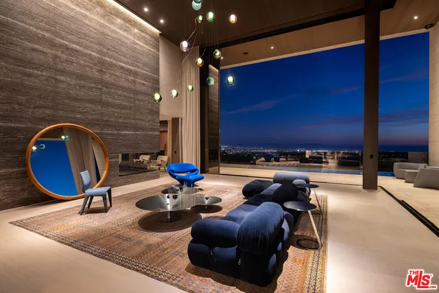 a kitchen with a table chairs and a refrigerator