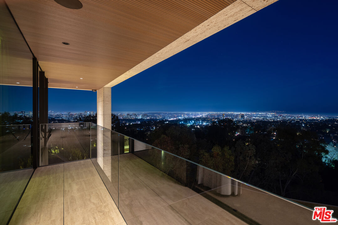 684 Firth Avenue Los Angeles, CA 90049 - Photo 24 of 27 a view of balcony with furniture and city view