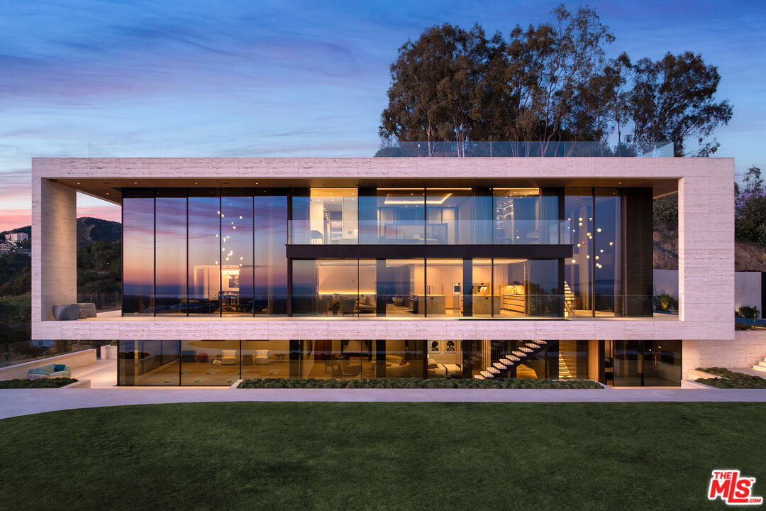 684 Firth Avenue Los Angeles, CA 90049 - Photo 3 of 27 a front view of a house with a yard