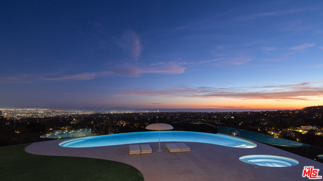 684 Firth Avenue Los Angeles, CA 90049 - Photo 5 of 27 a view of lake with mountain in the background