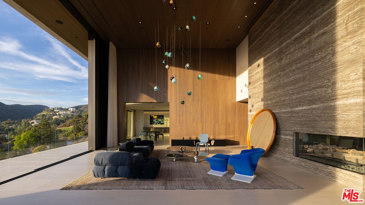 684 Firth Avenue Los Angeles, CA 90049 - Photo 7 of 27 a building outdoor space with patio furniture and a fireplace