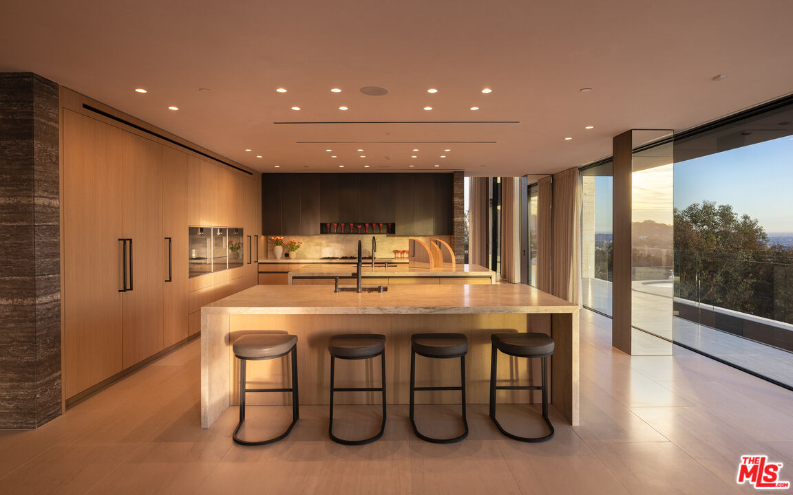 684 Firth Avenue Los Angeles, CA 90049 - Photo 10 of 27 a kitchen with a table and chairs