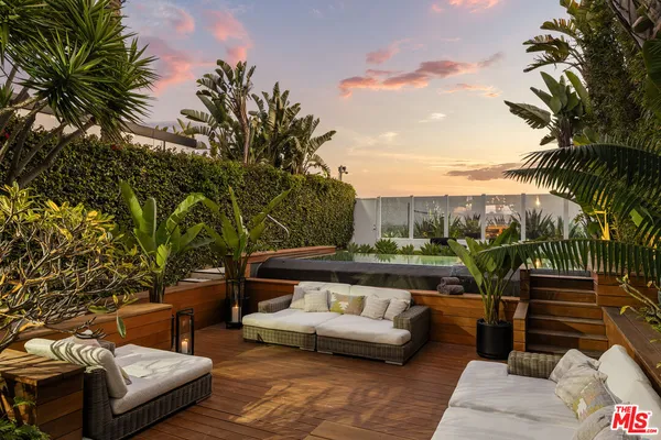 a view of a tall building with a yard