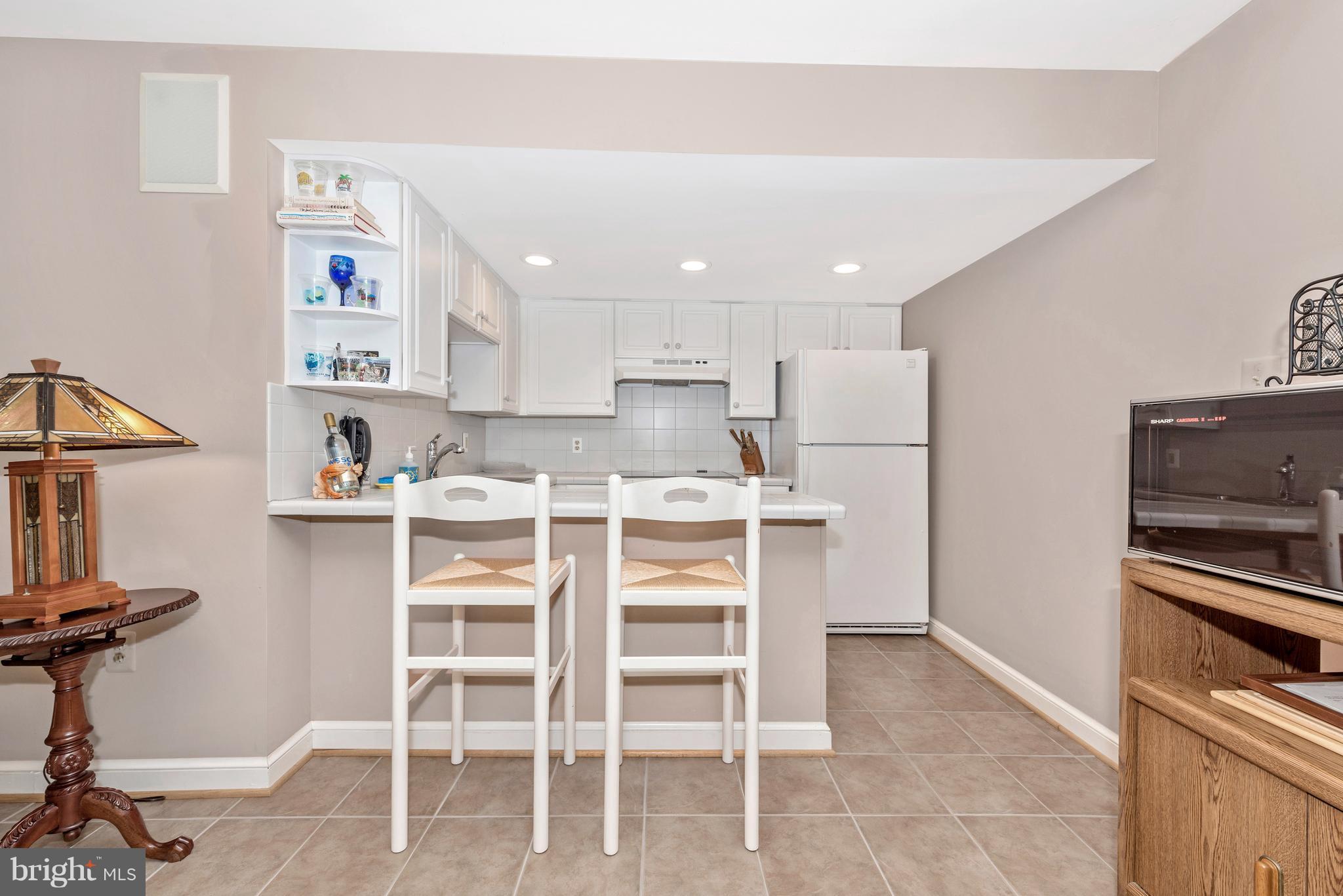 1880 Florence Road Mount Airy, MD 21771 - Photo 22 of 30 a kitchen with a refrigerator and cabinets