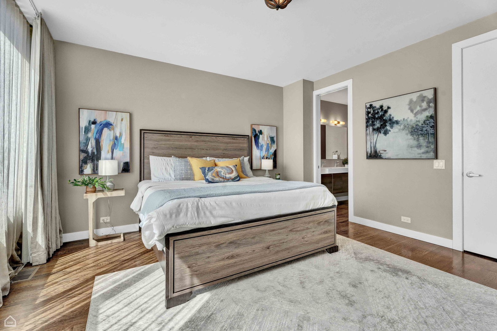 448 West Oak Street Chicago, IL 60610 - Photo 11 of 28 a bedroom with a bed and a painting on the wall