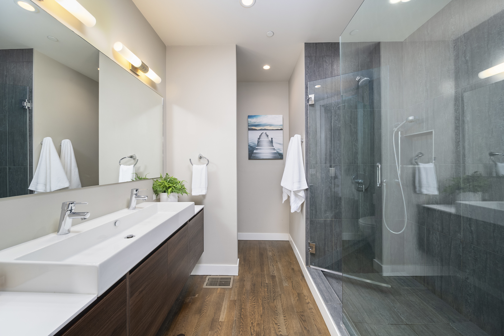 448 West Oak Street Chicago, IL 60610 - Photo 12 of 28 a bathroom with a double vanity sink mirror and shower