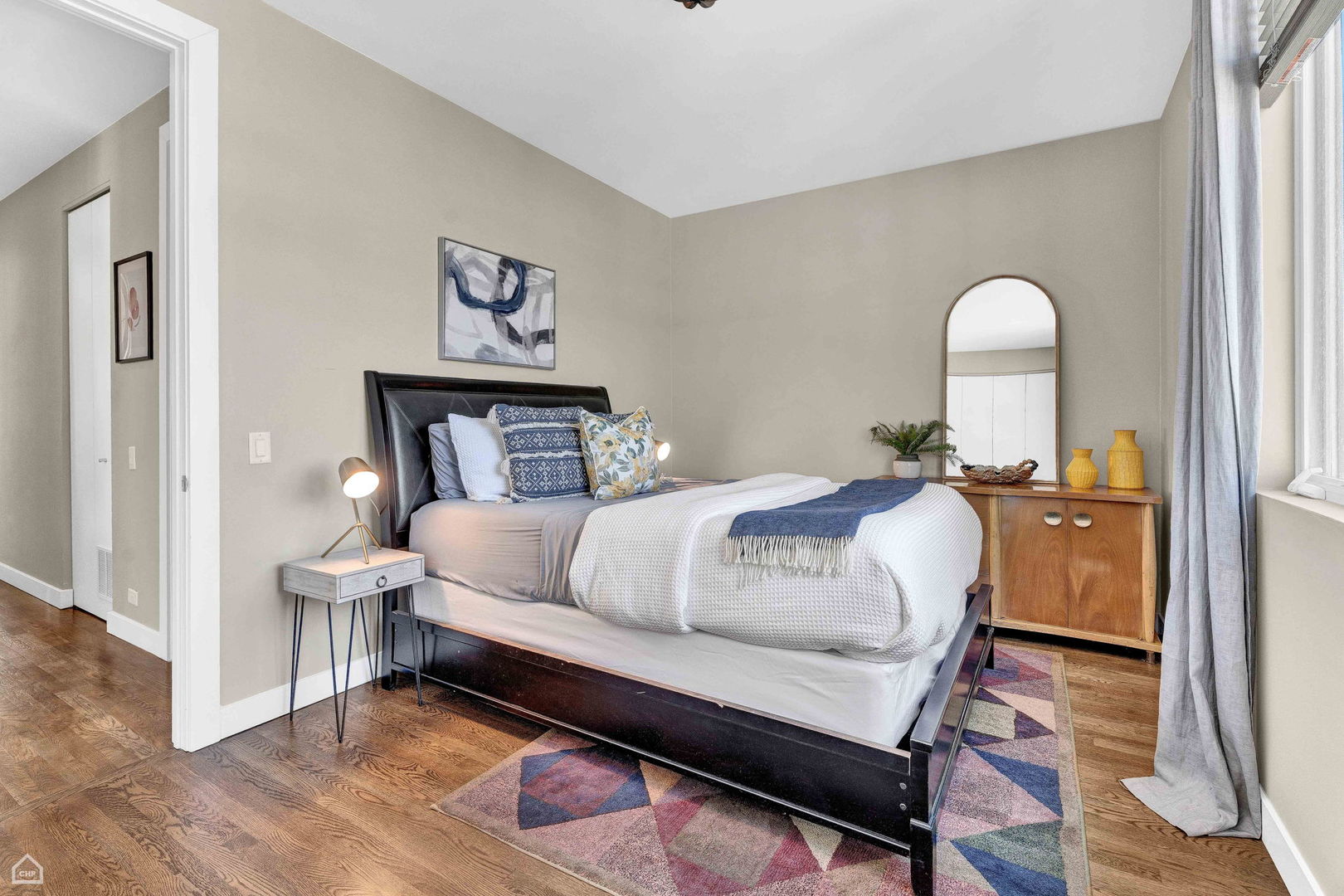 448 West Oak Street Chicago, IL 60610 - Photo 13 of 28 a bedroom with a bed and wooden floor