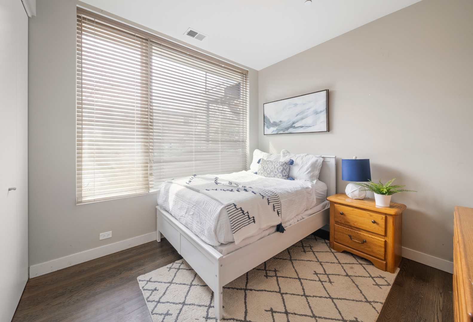 448 West Oak Street Chicago, IL 60610 - Photo 20 of 28 a bedroom with a bed and a window