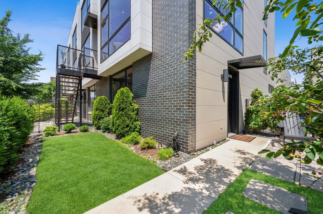 448 West Oak Street Chicago, IL 60610 - Photo 23 of 28 a view of a house with a yard and plants