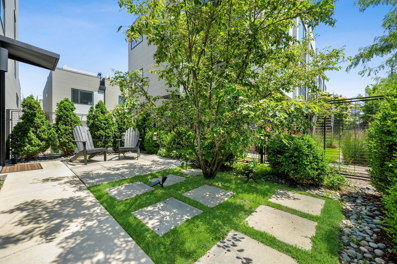 448 West Oak Street Chicago, IL 60610 - Photo 24 of 28 a view of a backyard with plants and a garden