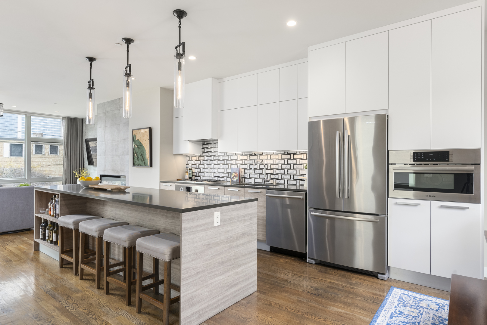 448 West Oak Street Chicago, IL 60610 - Photo 5 of 28 a kitchen with stainless steel appliances granite countertop a refrigerator a sink and a stove