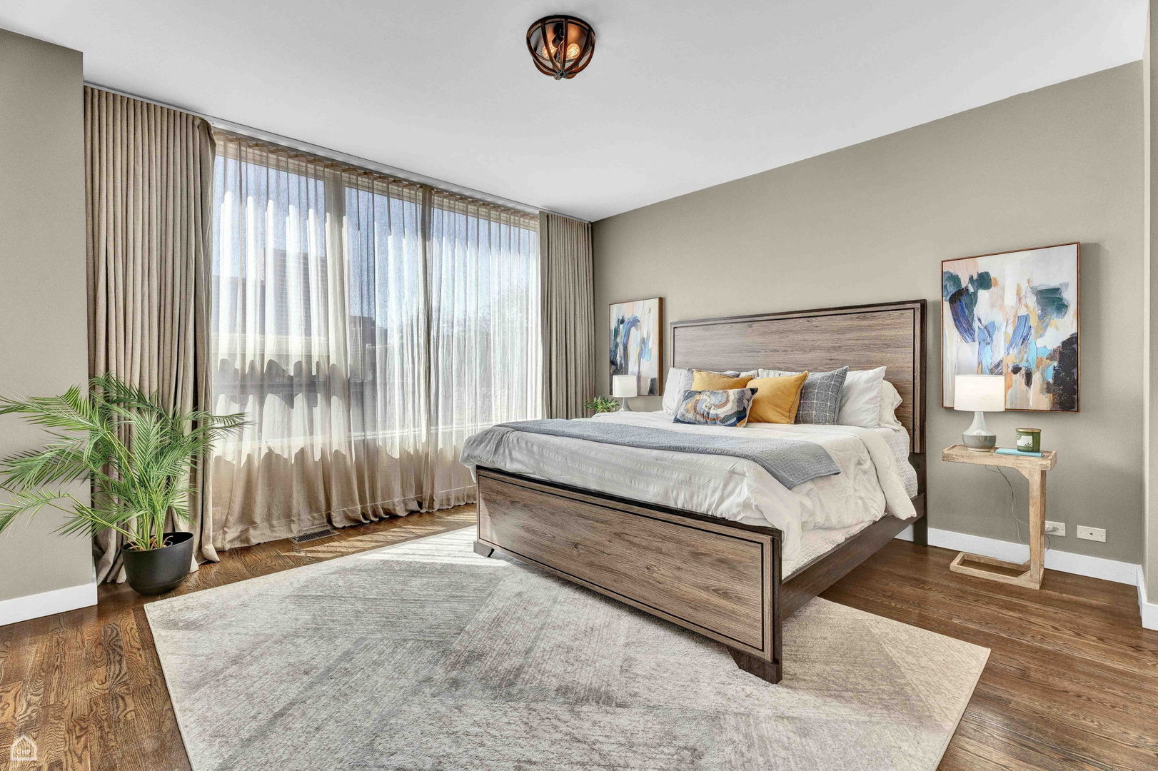 448 West Oak Street Chicago, IL 60610 - Photo 10 of 28 a bedroom with a large bed and a potted plant