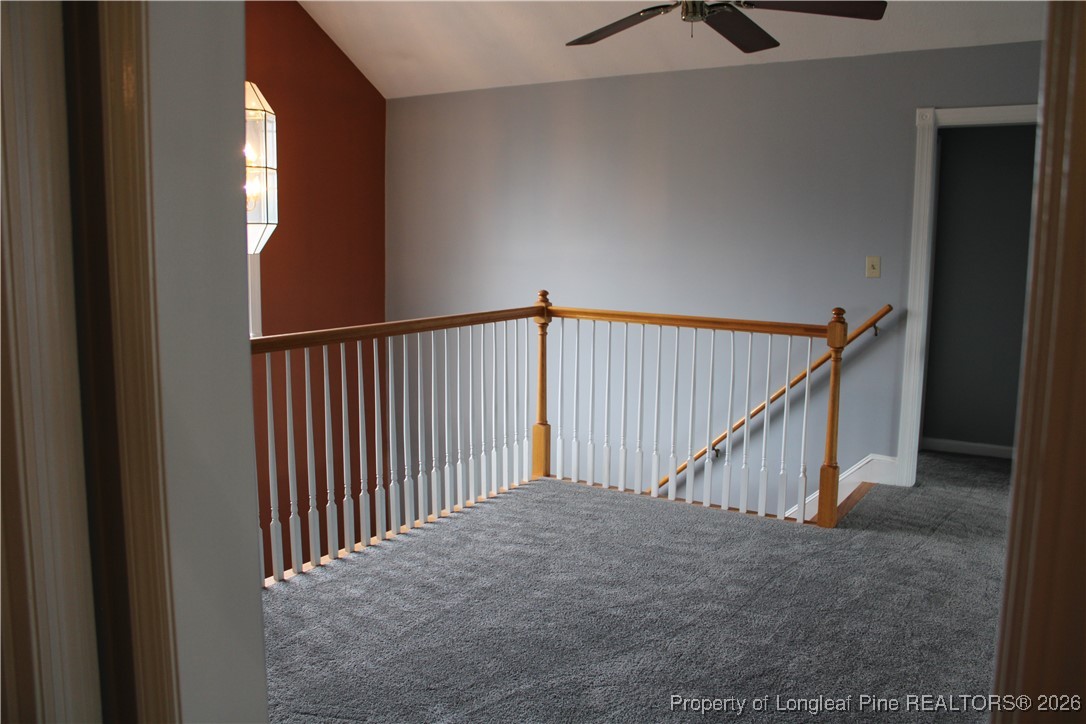 573 Porter Road Hope Mills, NC 28348 - Photo 24 of 29 a view of staircase with white walls and a window