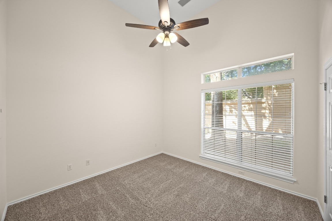 2918 Ranch Road 620 North, Unit X201 Austin, TX 78734 - Photo 19 of 30 an empty room with a window and a fan