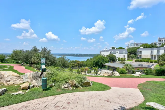 a view of a lake with a yard