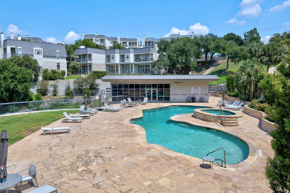 2918 Ranch Road 620 North, Unit X201 Austin, TX 78734 - Photo 25 of 30 a view of a swimming pool and lounge chairs in the patio