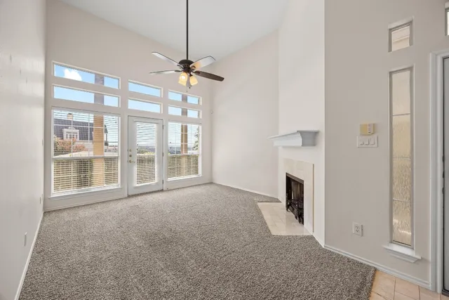 a view of empty room with fireplace