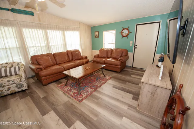a living room with furniture and a table