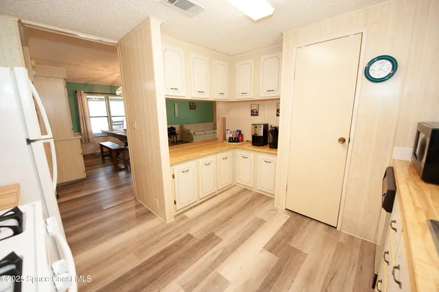 a view of a bathroom with a sink a mirror and a toilet