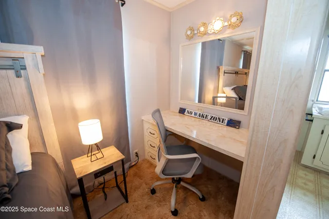 a bedroom with a bed and window