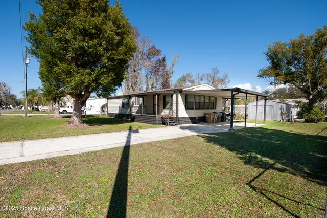 a view of a park with houses