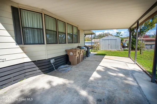 a view of a backyard of the house