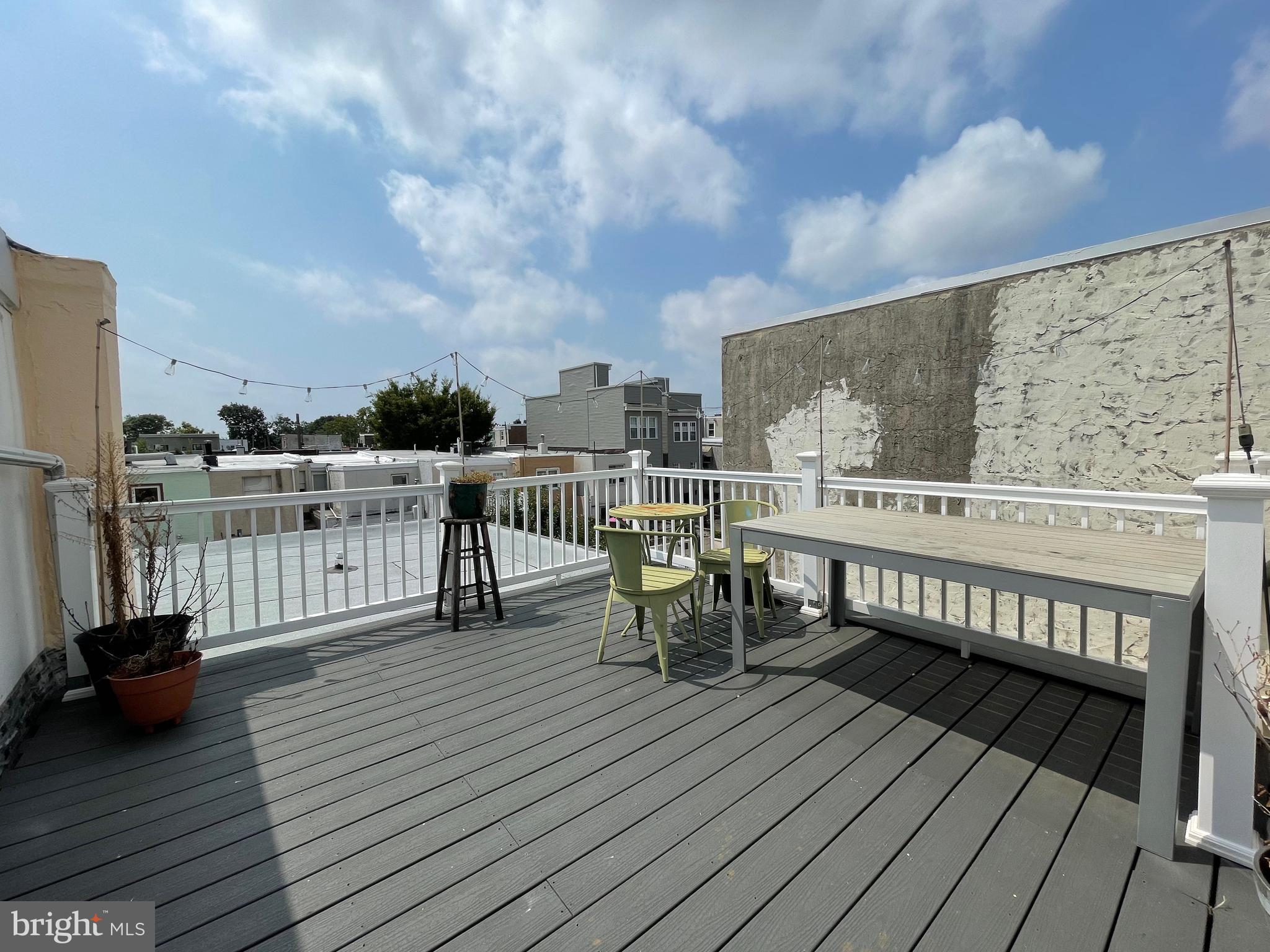 1230 Federal Street Philadelphia, PA 19147 - Photo 12 of 12 a view of a roof deck with chair and wooden floor