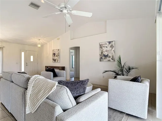a kitchen with granite countertop a sink and cabinets