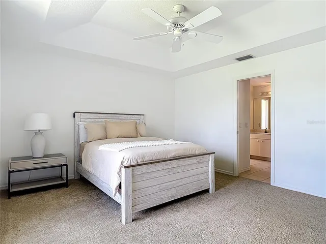 a large bathroom with a sink and a large mirror