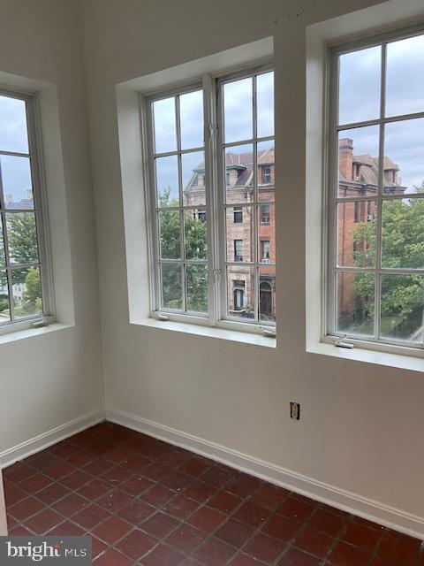2511 Eutaw Place, Unit 402 Baltimore, MD 21217 - Photo 15 of 18 an empty room with a window