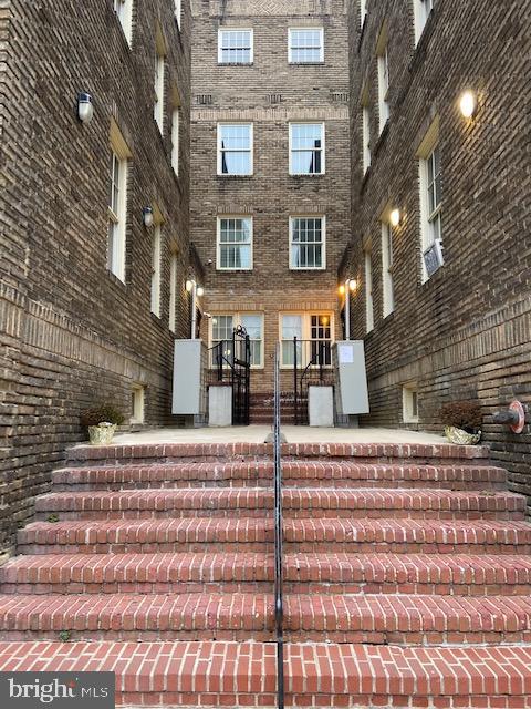 2511 Eutaw Place, Unit 402 Baltimore, MD 21217 - Photo 2 of 18 a front view of a house with a street