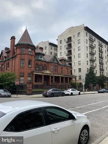 a front view of a building with street view