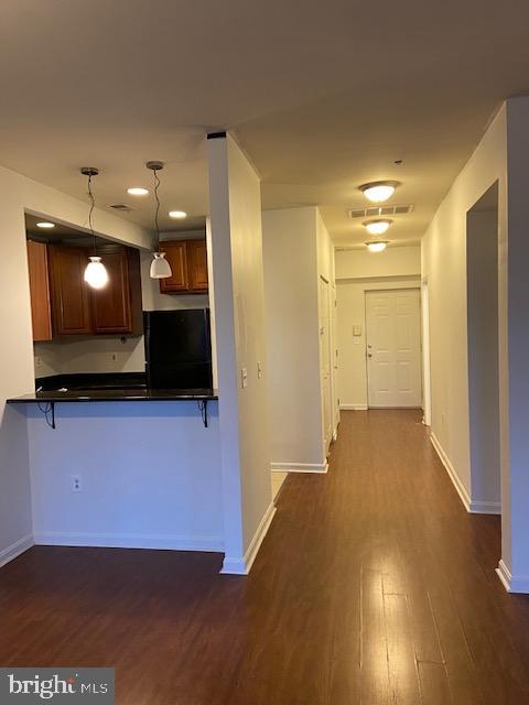 2511 Eutaw Place, Unit 402 Baltimore, MD 21217 - Photo 7 of 18 a view of a living room with a flat screen tv
