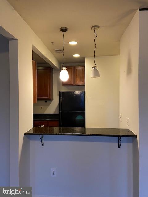 2511 Eutaw Place, Unit 402 Baltimore, MD 21217 - Photo 8 of 18 a view of a room with wooden floor and a ceiling fan
