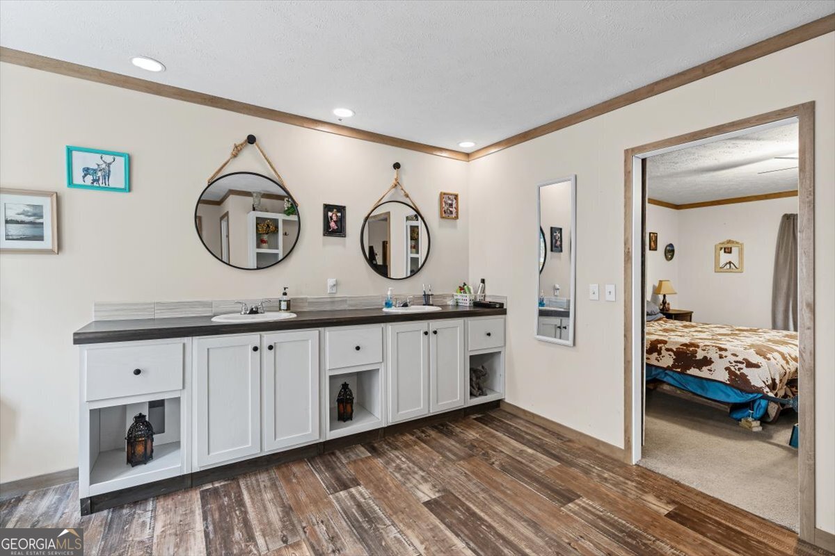 152 Campbell Road Cedartown, GA 30125 - Photo 15 of 42 a spacious bathroom with a double vanity sink and a mirror