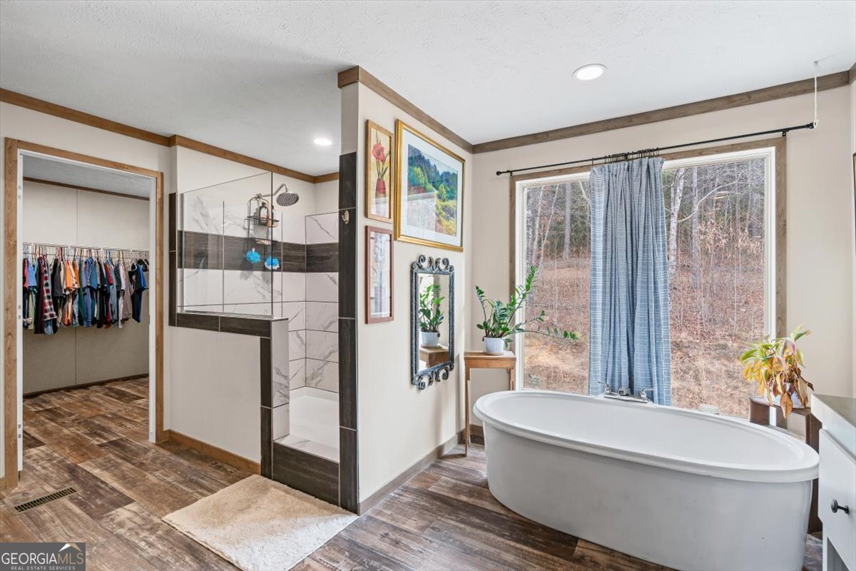 152 Campbell Road Cedartown, GA 30125 - Photo 16 of 42 a bathroom with a bathtub and a shower