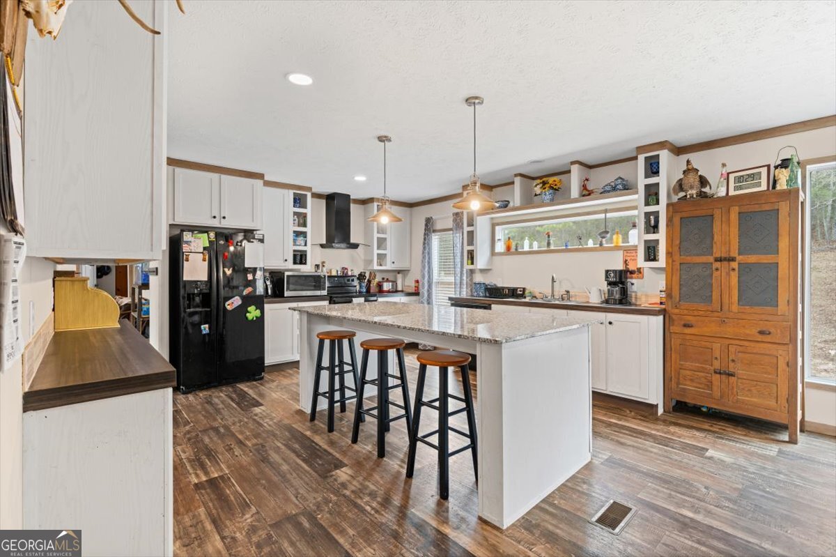 152 Campbell Road Cedartown, GA 30125 - Photo 21 of 42 a kitchen with white cabinets and stainless steel appliances