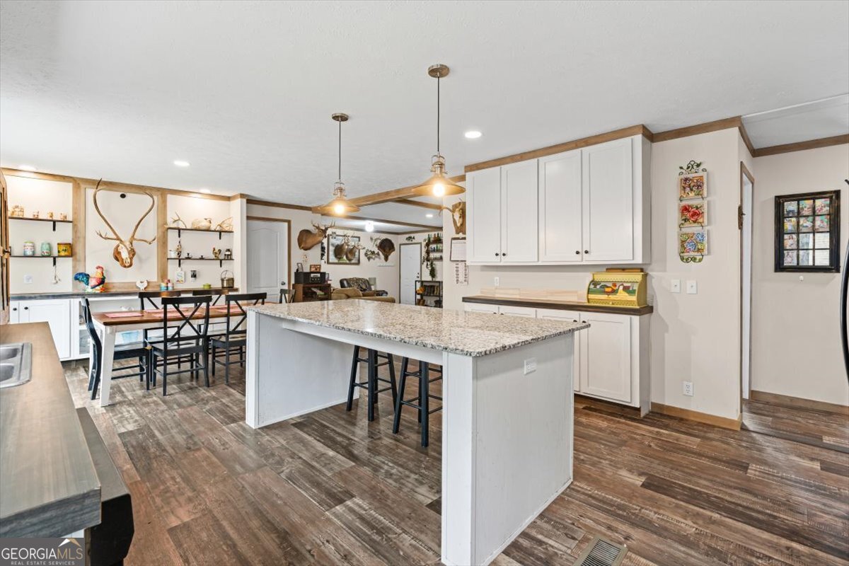 152 Campbell Road Cedartown, GA 30125 - Photo 22 of 42 a kitchen with a sink cabinets and wooden floor