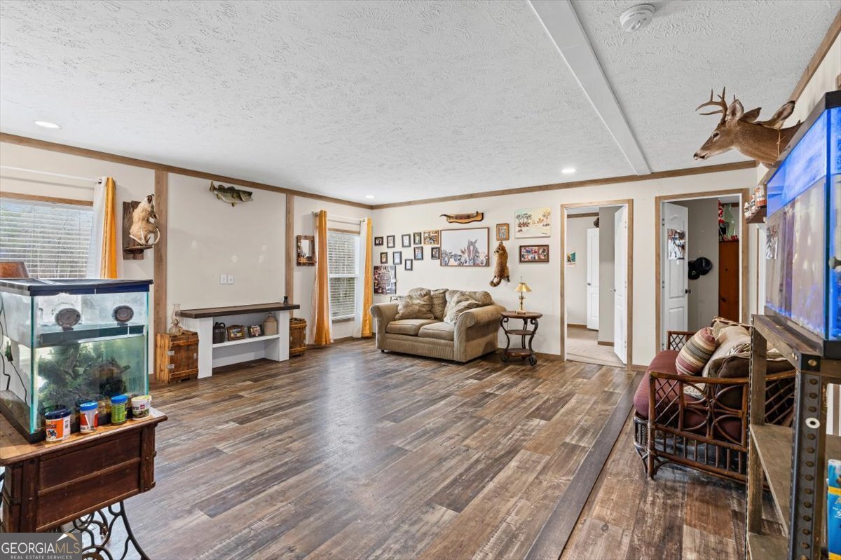 152 Campbell Road Cedartown, GA 30125 - Photo 26 of 42 a living room with furniture and a flat screen tv